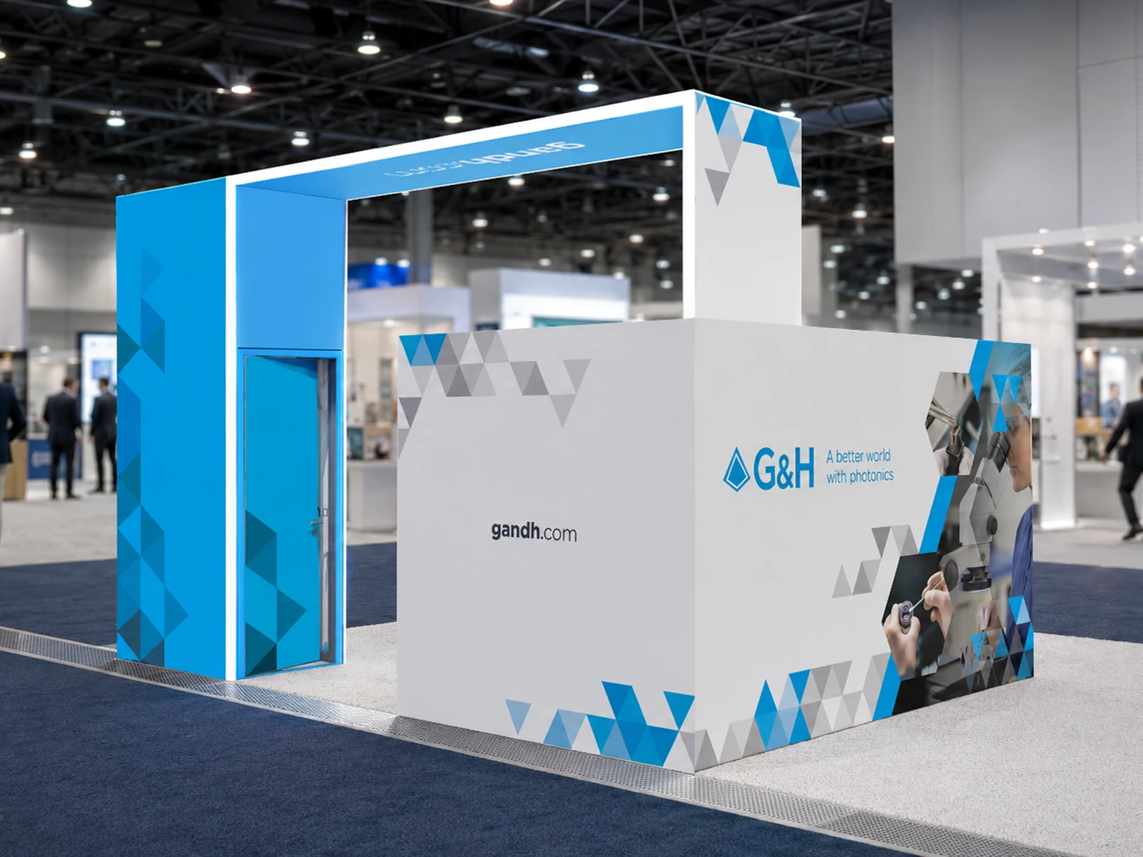 Rear booth view designed to carry the brand seamlessly across every visible angle, including the private meeting area and entry